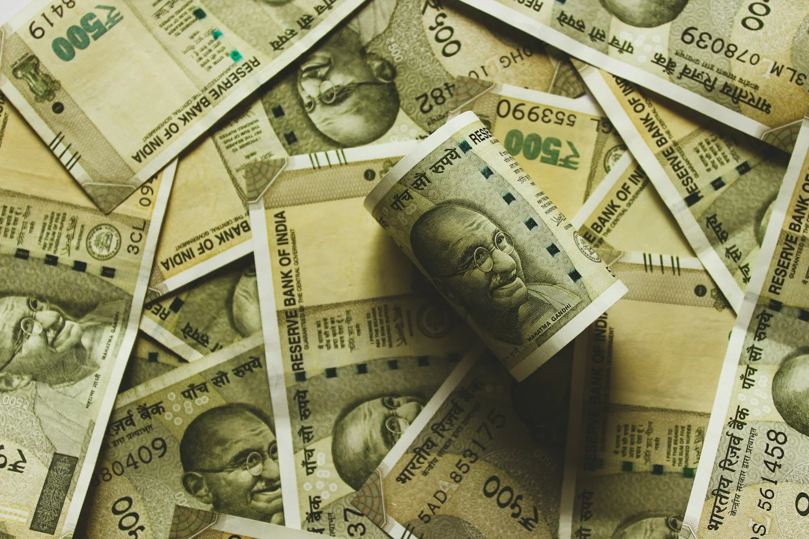 Overhead photo of Indian rupee banknotes representing GST calculation